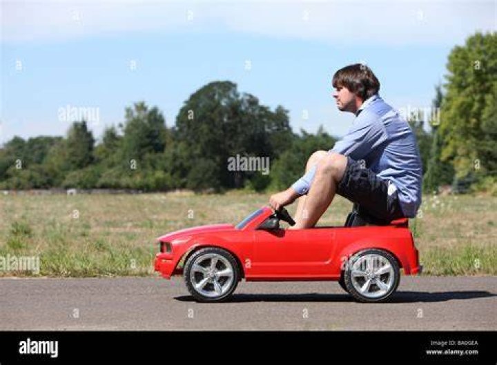 Large man in car